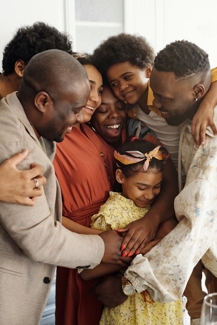 Heartwarming family group hug showcasing affection and togetherness indoors.